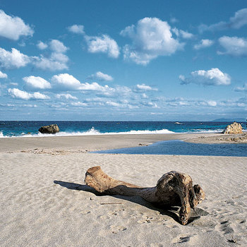 Solitude at Potistika, the marvelous beach of Ksinovrisi. The fresh water of the mountain pouring inside the dark-cyan sea.