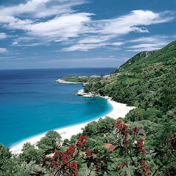 The beach of Papa-Nero at Ai-Giannis (Saint John), green-blue, home of an unbeatable summer.